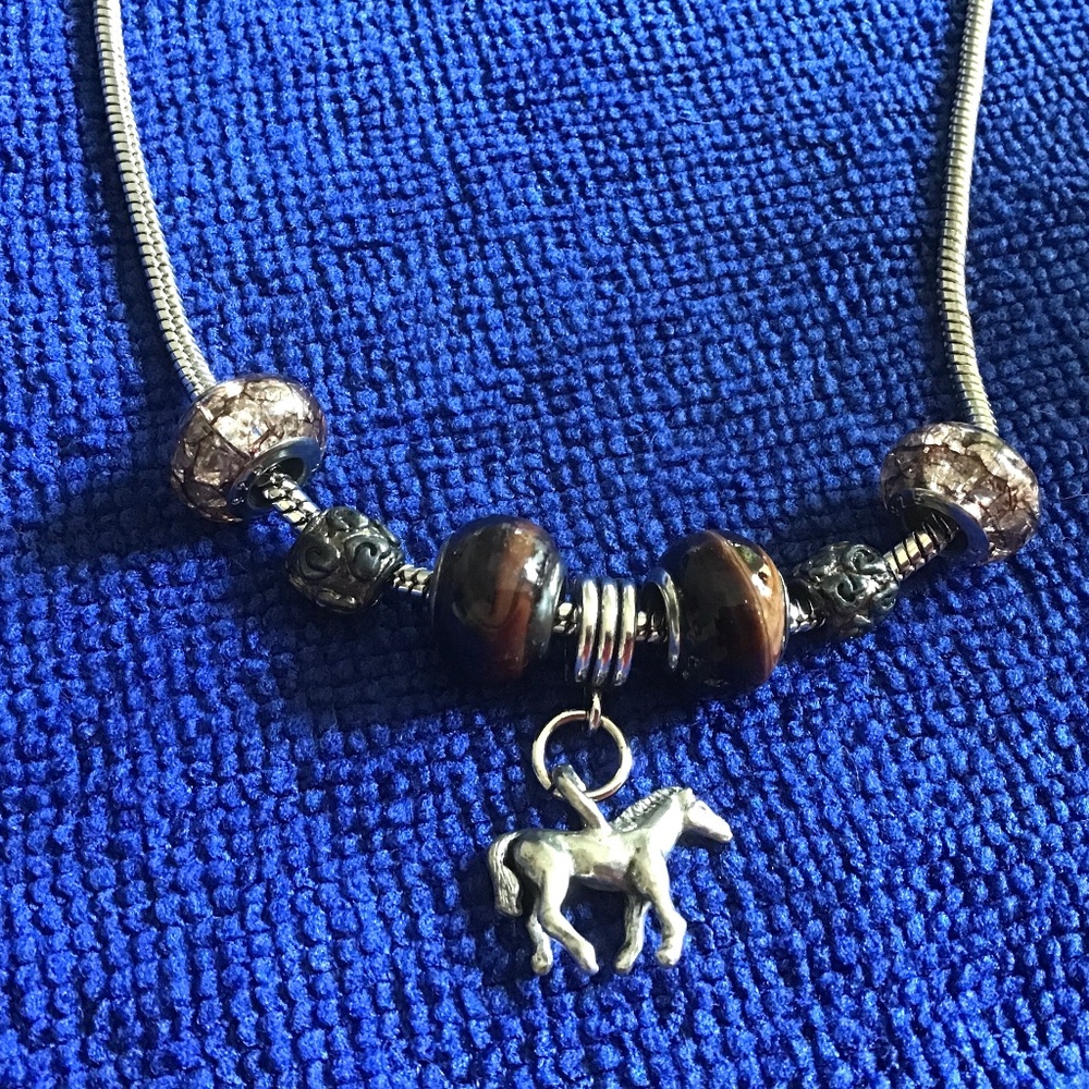 Cable necklace with round glass beads and a charm - silver and brown